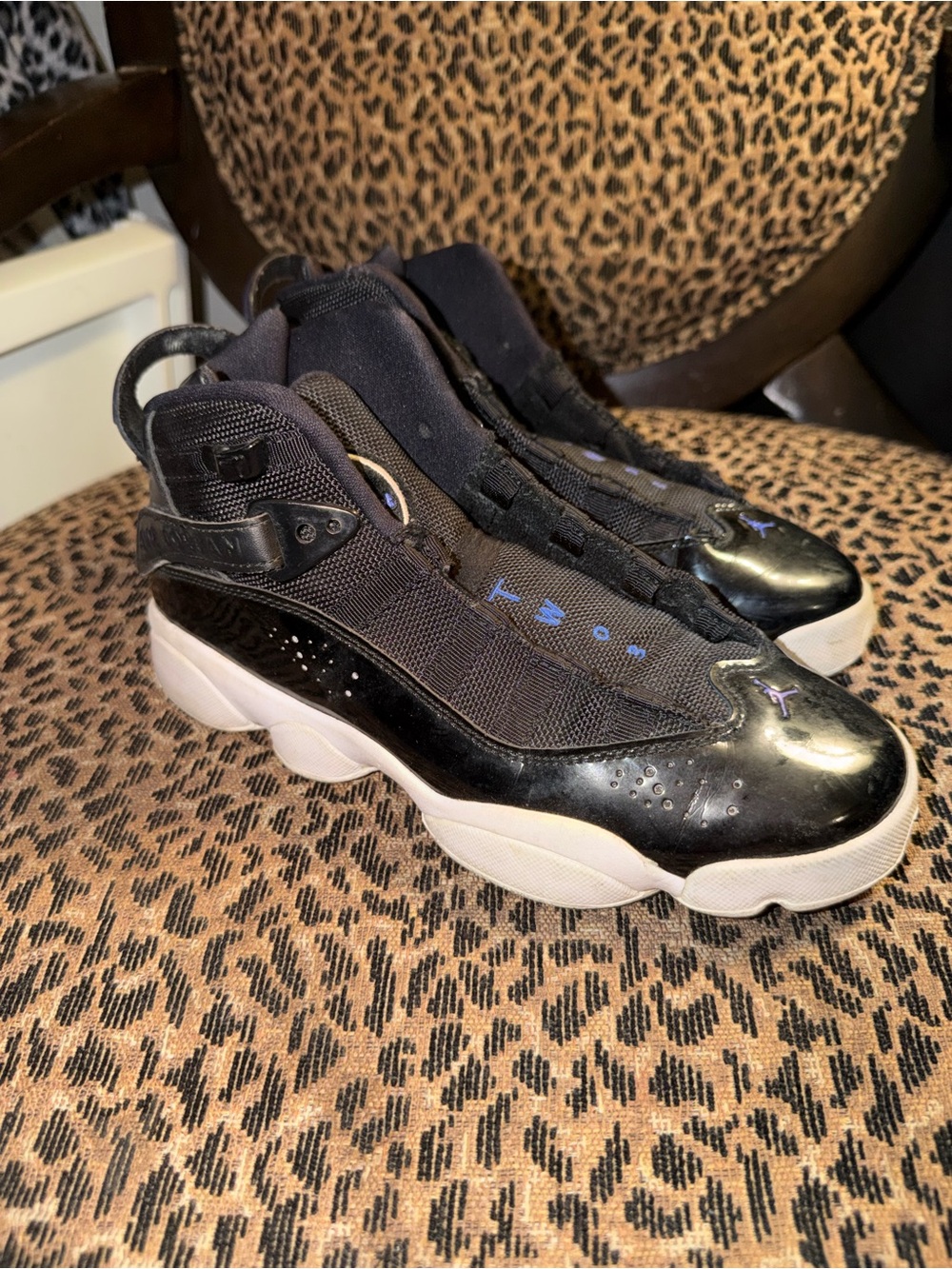 Jordan Kids Black and White High-Top Sneakers with Blue Accents